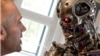 Austria -- A visitor looks at a robot figure from the movie 'the Terminator', inside the house where Austrian actor Arnold Schwarzenegger was born, in the southern Austrian village of Thal, 07Oct2011