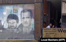 Совместное изображение Башара Асада и лидера "Хизбаллы" Хасана Насраллы на плакате в Дамаске