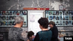 People gather at School No.1 on September 1 to commemorate the victims of the 2004 Beslan school siege.