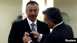 Azerbaijani President Ilham Aliyev received Turkey's State Honor Medal from Turkish President Abdullah Gul during a ceremony at the Presidential Palace in Ankara on November 12.