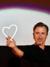 BOSNIA-HERZEGOVINA -- British actor and film director Tim Roth poses with his "Heart of Sarajevo" award at the Open Air Cinema of the 25th Sarajevo Film Festival, in Sarajevo, August 20, 2019