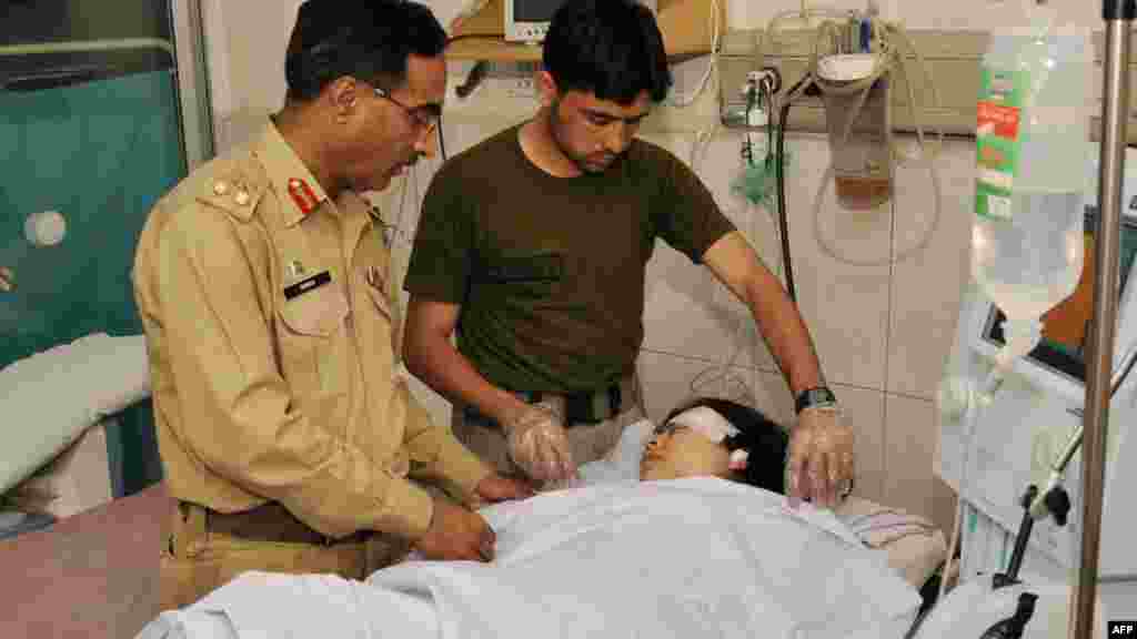 Army doctors treat Malala at a military hospital, where she underwent surgery to remove a bullet.