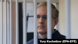 Paul Whelan, a former U.S. marine who was convicted for allegedly spying in Russia, stands inside a defendants' cage while attending a court hearing in Moscow. (file photo)