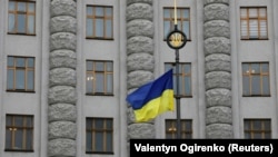 A Ukrainian flag flies in front of a government building in central Kyiv (file photo)