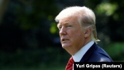 U.S. -- U.S. President Donald Trump walks on the South Lawn of the White House in Washington, U.S., before his departure to Yuma, Arizona, August 22, 2017