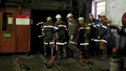 Coal miners enter the shaft at the Kostenko mine in Qaraghandy.