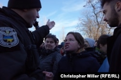 Ukrainian police move on transgender rights activists after their rally in a Kyiv park was disrupted by far-right radicals on November 18.