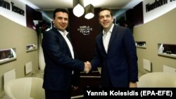 Greek Prime Minister Alexis Tsipras (right) and Macedonia counterpart Zoran Zaev meet in Davos on January 24.