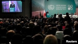 Delegates take part in the opening ceremony of the 19th conference of the United Nations Framework Convention on Climate Change at the National Stadium in Warsaw on November 11.