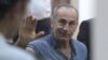 Former Armenian President Robert Kocharian waves to supporters during his trial, Yerevan, September 20, 2019.