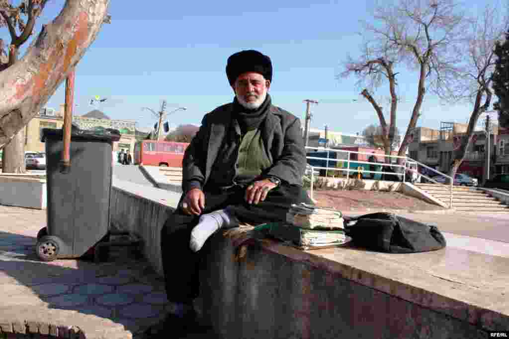 For a small fee, Ismayil writes prayers for customers to ward off fear, ensure success, and solve romantic problems.