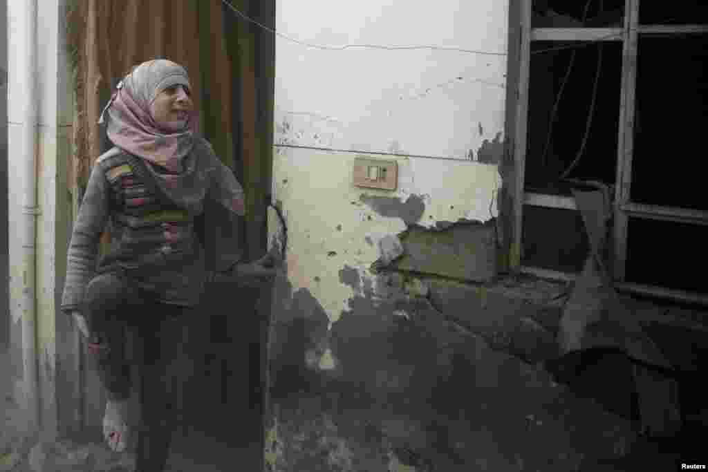 An injured girl reacts after an air strike in the rebel-held Douma neighburhood of Damascus, Syria. (Reuters/Bassam Khabieh)
