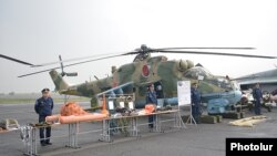 Armenia - Russian Air Force officers and a combat helicopter at the Erebuni airbase in Yerevan, 12Mar2016.