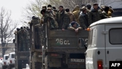 Nagorno-Kararbakh -- Volunteers of the defense army of Nagorno-Karabakh ride on trucks in Stepanakert, April 7, 2016