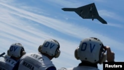 An X-47B pilotless drone combat aircraft -- as big as a fighter jet -- is launched for the first time off an aircraft carrier in the Atlantic Ocean off the coast of Virginia on May 14.