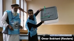 FILE: Afghan election commission workers prepare ballot papers for counting of the presidential election in Kabul in late September.