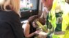 Emergency services tend to an injured woman following a blast on an Underground train at Parsons Green tube station in west London on September 15.