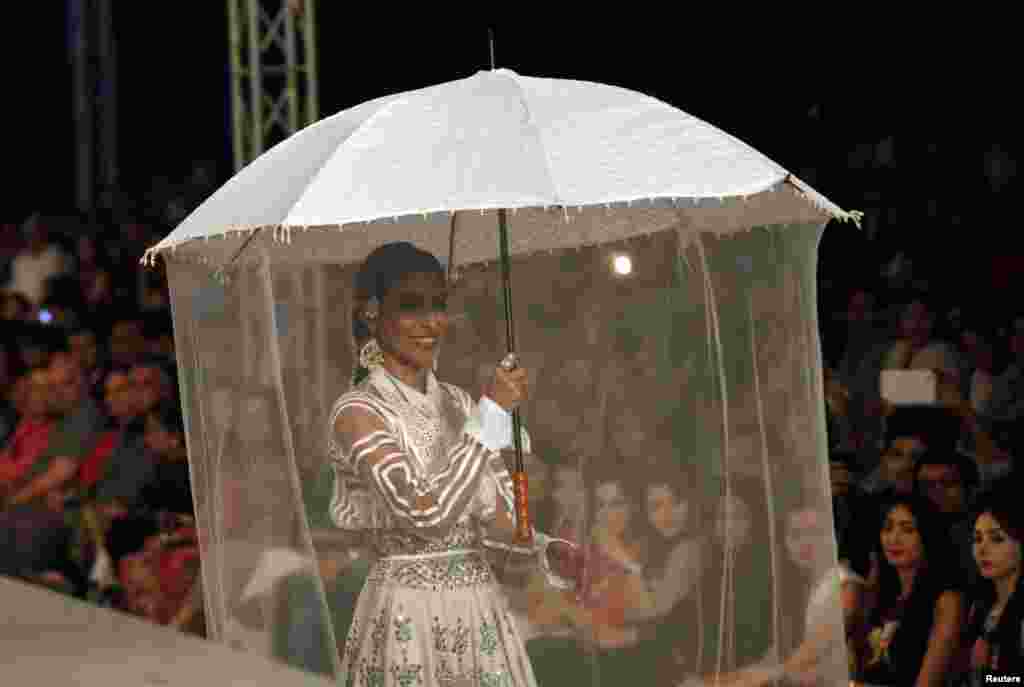 Model Misha presents a creation from the Ali Xeeshan collection during Lahore Fashion Week. More than 33 designers, brands, and textile houses presented their collections in the event sponsored by the Pakistan Fashion Design Council. (Reuters/Mohsin Raza)