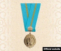 A file photo of the gold medal that the Kazakh state awards to women who have seven or more children.