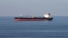 AT SEA -- Oil tankers pass through the Strait of Hormuz, December 21, 2018. 