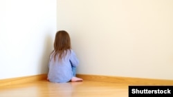 Generic -- a punished girl in a corner @Shutterstock