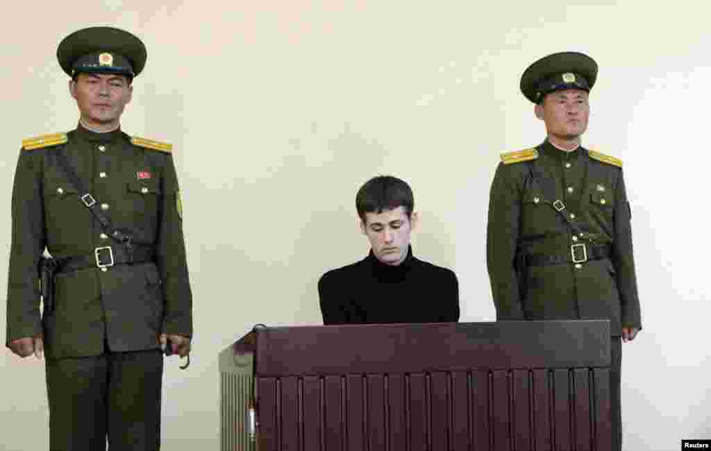 U.S. citizen Matthew Todd Miller sits in a witness box during his trial at the North Korean Supreme Court in this undated photo released by North Korea&#39;s Korean Central News Agency (KCNA) in Pyongyang. North Korea sentenced Miller to six years hard labor for committing &quot;hostile acts&quot; as a tourist to the isolated country. Miller entered North Korea in April, demanding Pyongyang grant him asylum, according to a release from state media at the time. (Reuters/KCNA)