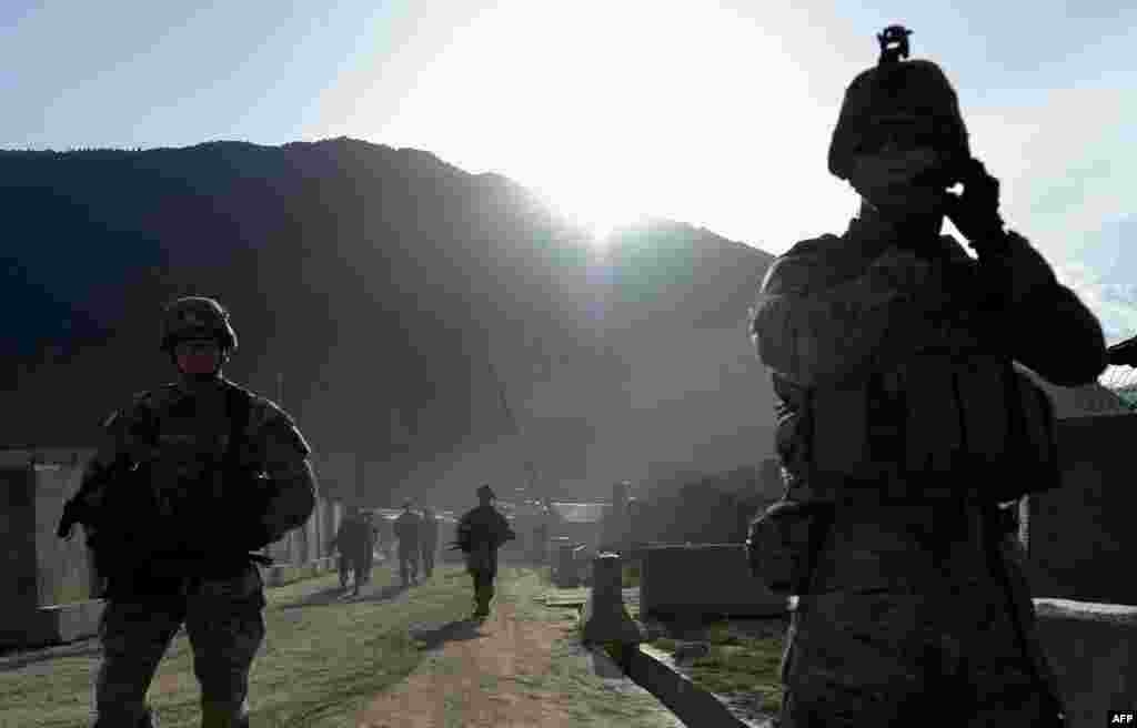 U.S. Army soldiers march from the Forward Base Honaker Miracle in Kunar Province, Afghanistan, during a joint patrol led by the Afghan National Army on April 18. (AFP/Manjunath Kiran)