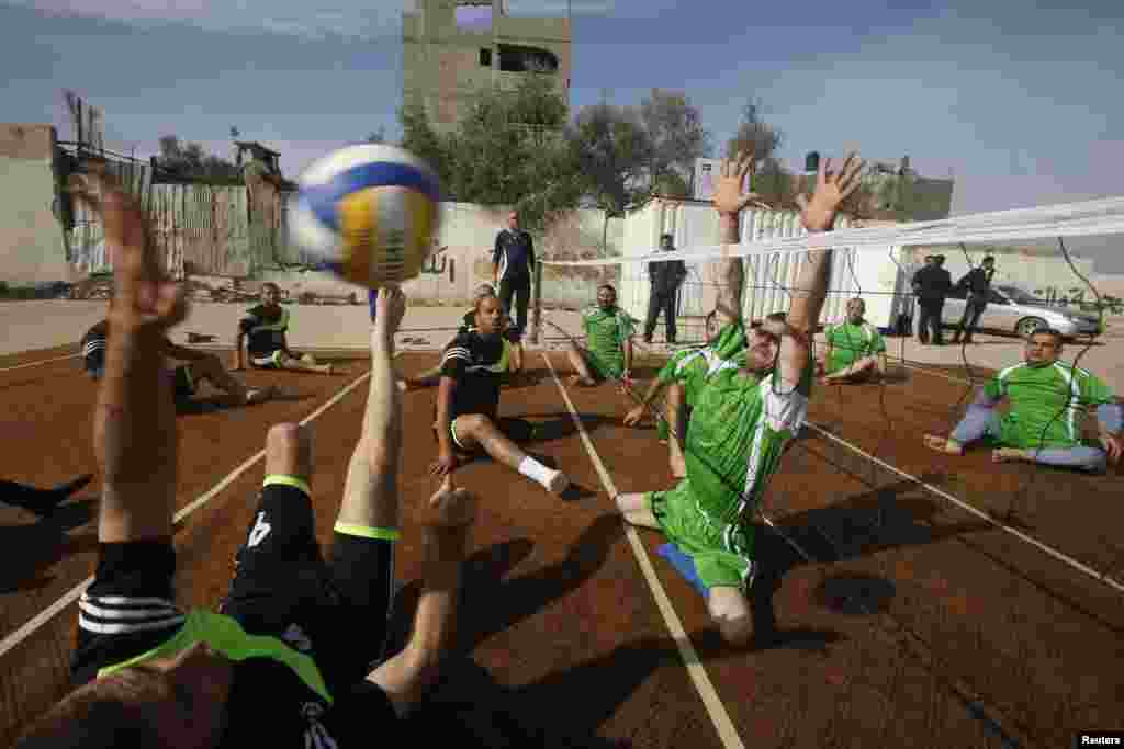 Disabled Palestinians take part in a volleyball training session in Gaza City on December 3. (Reuters/Suhaib Salem)