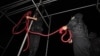 Iranian police officers prepare a noose ahead of an execution. (file photo)
