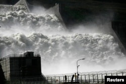 Visitors in 2013 look at the new spillway at the Sayano-Shushenskaya hydroelectric power station, 520 kilometers south of the Siberian city of Krasnoyarsk.