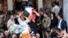 Iraqi Christians carry coffins during a funeral service at a church in Baghdad last year. 