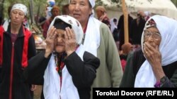 Torokul Doorov's winning photograph shows women offering their blessings at a circumcision celebration in Batken Region, Kyrgyzstan.