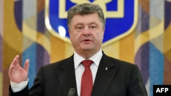 Ukrainian President Petro Poroshenko has called the signing of the Association Agreement a "historic moment" for his country.