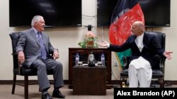 U.S. Secretary Tillerson (L) and Afgan President Ashraf Ghani meet in Kabul on October 23, 2017