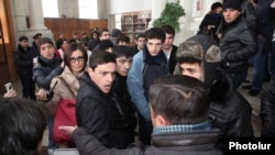 Armenia - Pro-government youths prevent journalists from covering the supposedly public defense of Yerevan Mayor Taron Markarian's doctoral thesis, Yerevan, 26Dec2013.