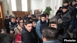 Armenia - Pro-government youths prevent journalists from covering the supposedly public defense of Yerevan Mayor Taron Markarian's doctoral thesis, Yerevan, 26Dec2013.