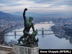 A dragon-pummeling bronze figure makes up part of Budapest's Liberty Monument.