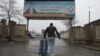 An Afghan refugee who was deported from Germany arrives with his belongings at the international airport in Kabul in January 2017.