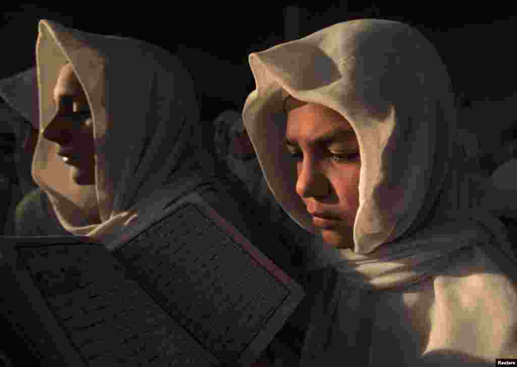 Students recite the Koran at the Abu Bakar Saddiq Jamia Mosque on the outskirts of Peshawar, Pakistan. (Reuters/Fayaz Aziz)