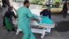 FILE: A wounded victim being carried into a hospital in Kabul on July 25. 