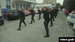 Сотрудники китайской частной военной компании во время тренировки.