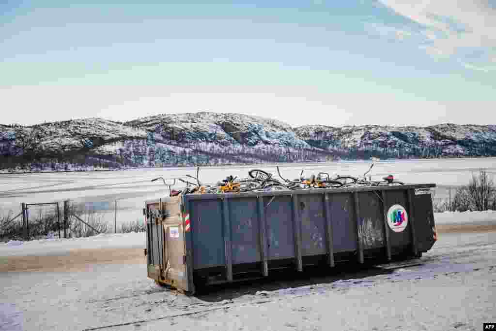 Bikes used by refugees to cross the border from Russia to the Norwegian border crossing station at Storskog are pictured after they were thrown into a recycling container. Migrants have to make the last section of their journey by bicycle because Russian authorities don't let pedestrians cross the border and Norway considers it human trafficking to transport migrants in a vehicle. (AFP/Jonathan Nackstrand)