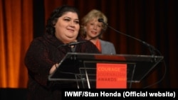 RFE/RL's Azerbaijani Service correspondent Khadija Ismayilova accepts the 2012 "Courage in Journalism" award from the International Women's Media Foundation in New York in October 2012.