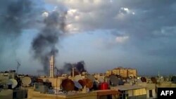 A video grab shows smoke billowing from the Damascus suburb of Douma during shelling by government forces on April 15.