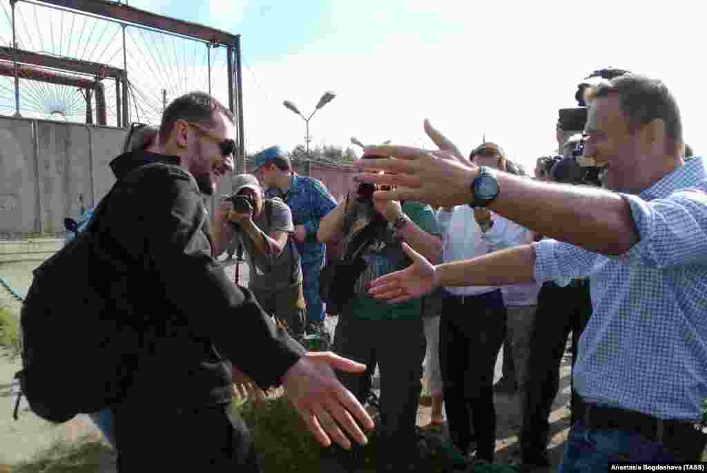 Russian opposition leader Aleksei Navalny (right) greets his brother Oleg Navalny (left) after he was released after spending 3 1/2 years in prison in the western Oryol region on June 29. In 2014, the two brothers were convicted of stealing about $500,000 from two Russian firms and of laundering some of the money. Both were sentenced to 3 1/2 years, but Aleksei's sentence was suspended. The European Court of Human Rights has ruled that the brothers were convicted unfairly. (TASS)