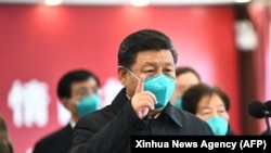 Președintele chinez Xi Jinping vizitează spitalul Huoshenshan din Wuhan, 10 martie 2020