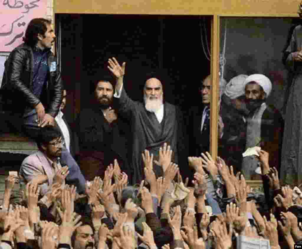 Khomeini addresses adoring crowds with his son Ahmad on February 1, 1979.