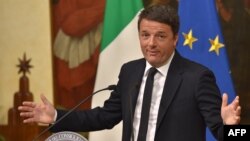 Italian Prime Minister Matteo Renzi announces his resignation following the results of the vote in Rome on December 4.