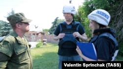 OSCE monitors visit the village of Sakhanka in the Donetsk region of Ukraine this month.