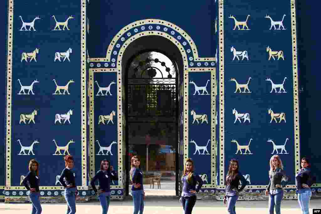 Iraqi candidates for the Miss Iraq beauty contest pose in front of the Ishtar Gate at the ancient archaeological site of Babylon, outside the modern city of Hilla, south of the capital, Baghdad. The beauty contest, which is the first one in more than 40 years in the country, will take place on December 19. (AFP/Ahmad al-Rubaye)